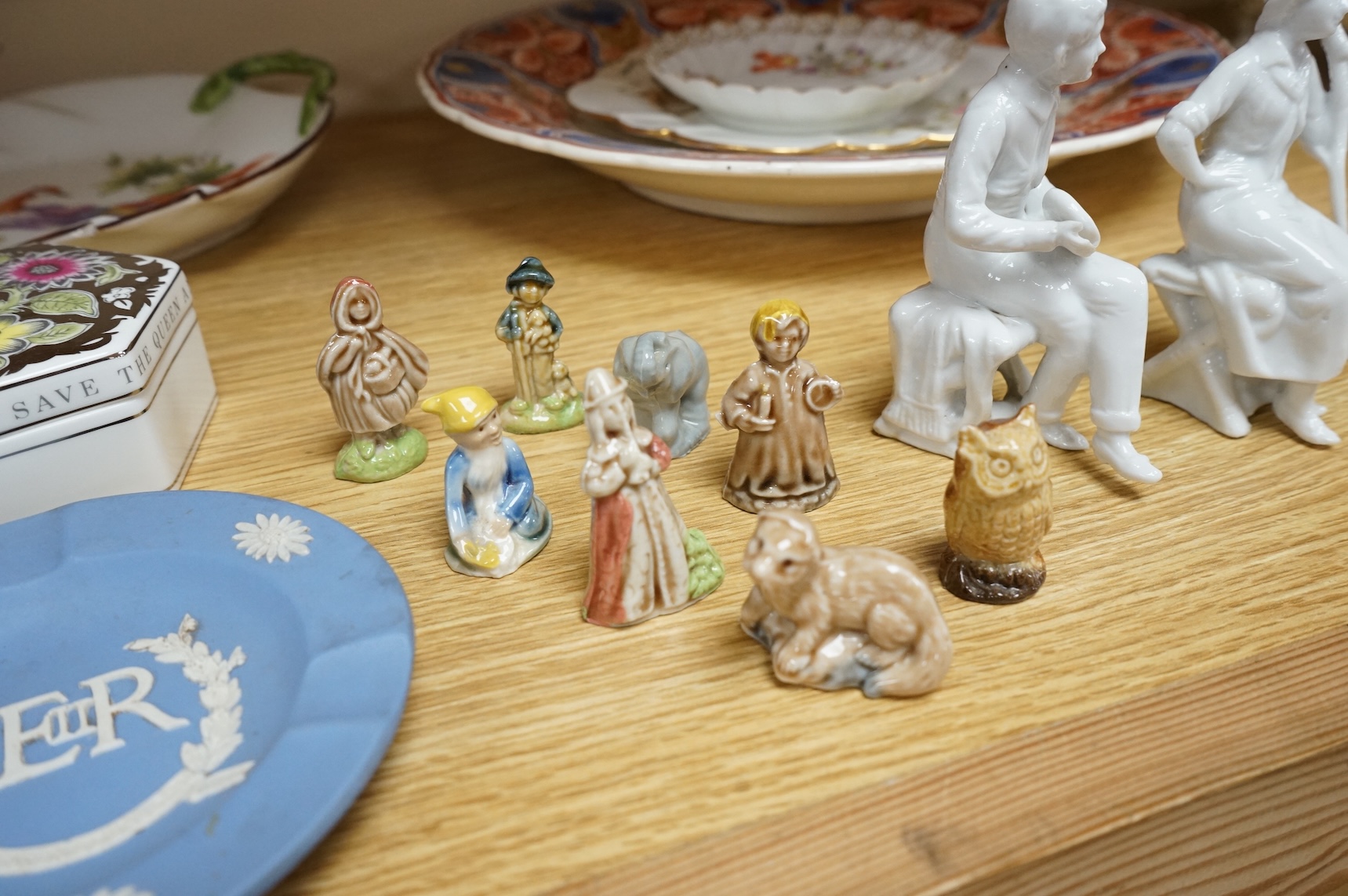 A collection of porcelain and pottery to include commemorative china, a leaf dish and group of wade figures, largest 29cm in diameter